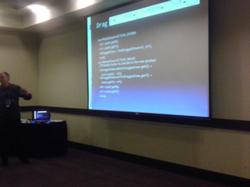 A conference talk with a slide of Android drag-handling code.